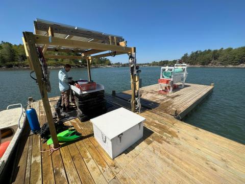 Photo of Max Burtis on his oyster farm in Brunswick, Maine