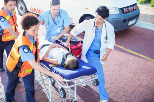 Ambulance crew, and patient on stretcher