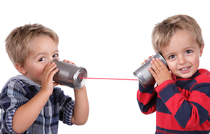 two kids with tin can phones